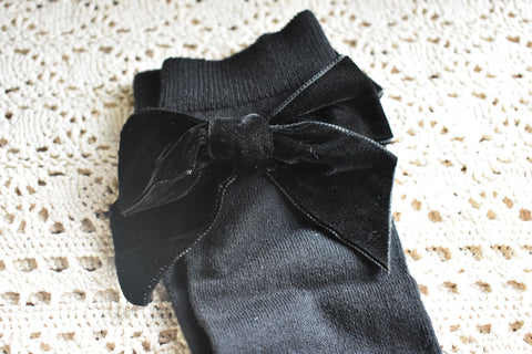 Black knee highs with matching velvet bow